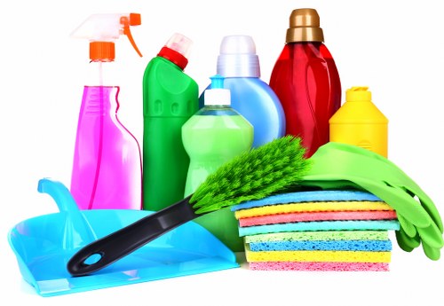 Professional carpet cleaner working on a London home